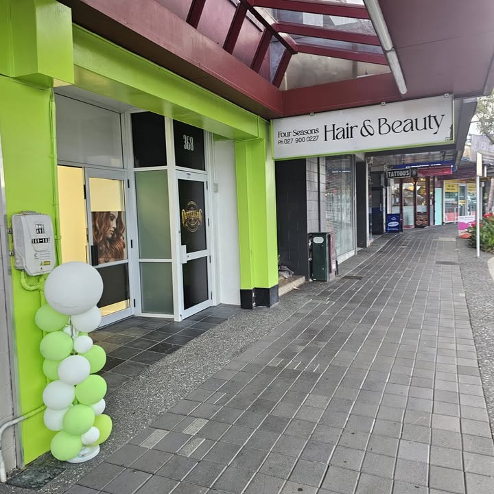 The lime green facade of Four Seasons Hair & Beauty on Great North Road